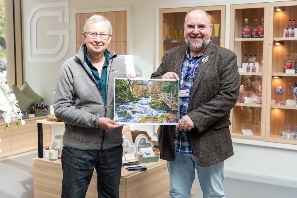 Forrest Weir, winner of the 2026 Calendar Competition, pictured with Stephen Harper, Ayrshire Hospice Ecommerce Manager
