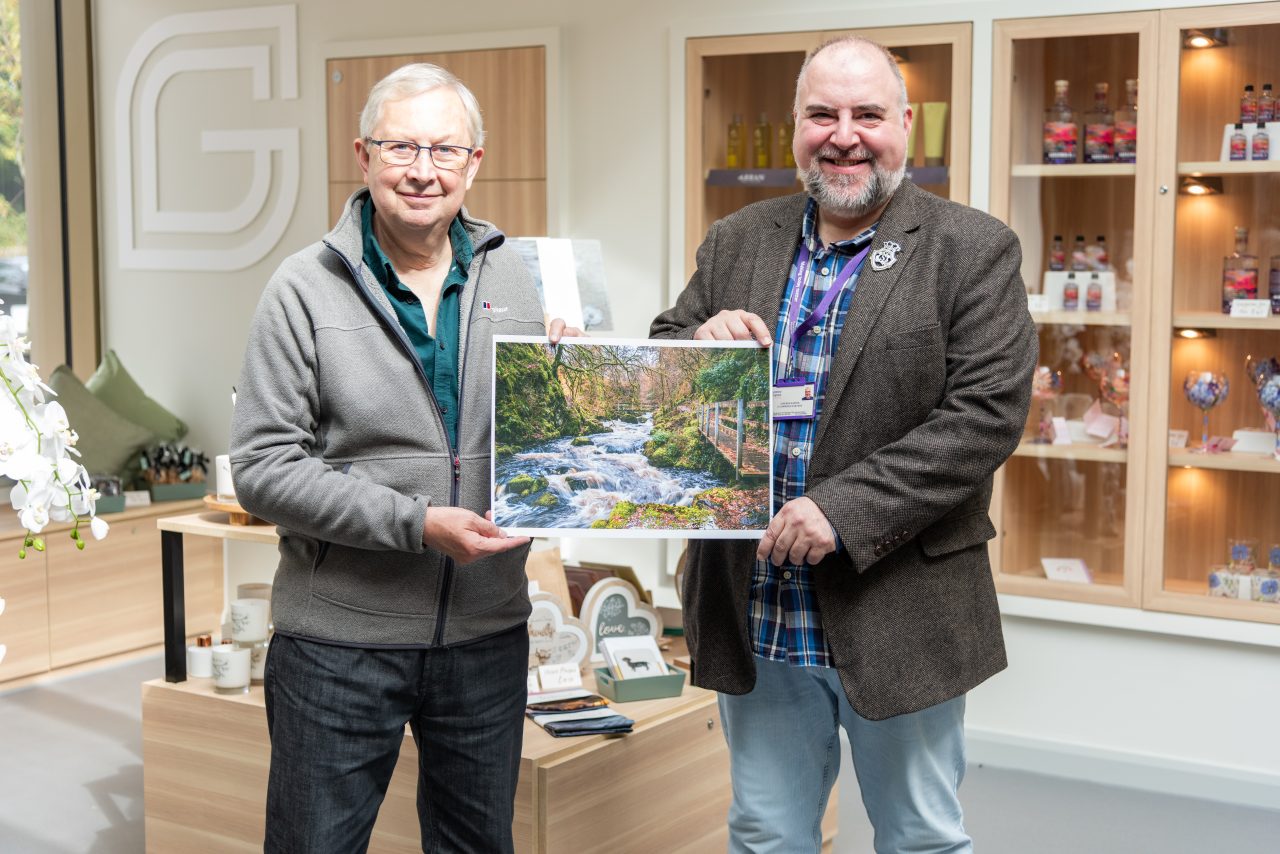 Forrest Weir, winner of the 2026 Calendar Competition, pictured with Stephen Harper, Ayrshire Hospice Ecommerce Manager