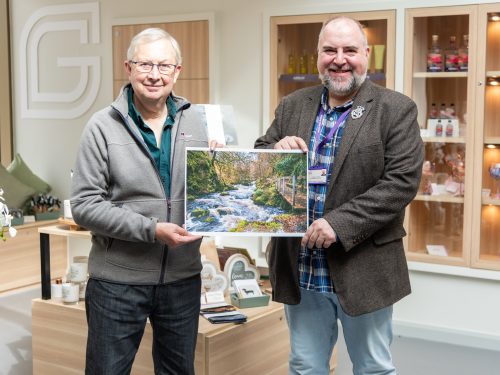 Forrest Weir, winner of the 2026 Calendar Competition, pictured with Stephen Harper, Ayrshire Hospice Ecommerce Manager